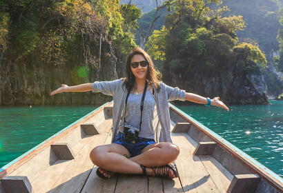 Sitting on Boat Spreading Her Arms